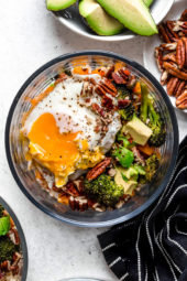Overhead view of Buddha bowl with runny yolk egg
