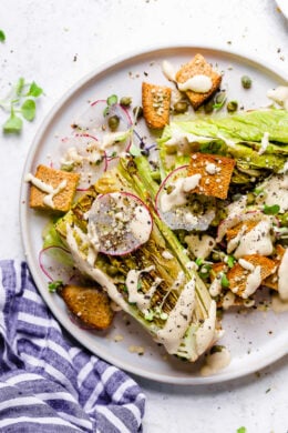 Plate of vegan Caesar salad with grilled romaine.