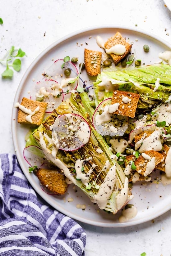 Plate of vegan Caesar salad with grilled romaine.