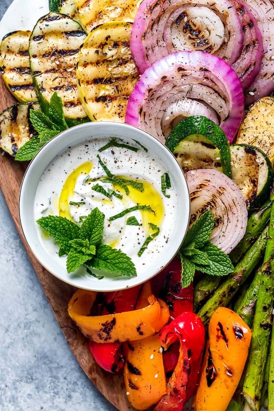 This beautiful, Grilled Vegetable Platter with Yogurt Mint Sauce is so colorful. An easy summer side dish made with asparagus, zucchini, squash, red onion and bell peppers.