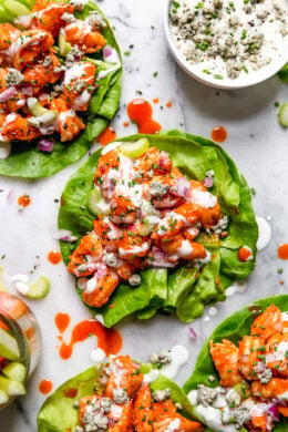 These easy, low-carb Buffalo Shrimp Lettuce Wraps are spicy, light and delicious topped with celery and blue cheese or ranch dressing.