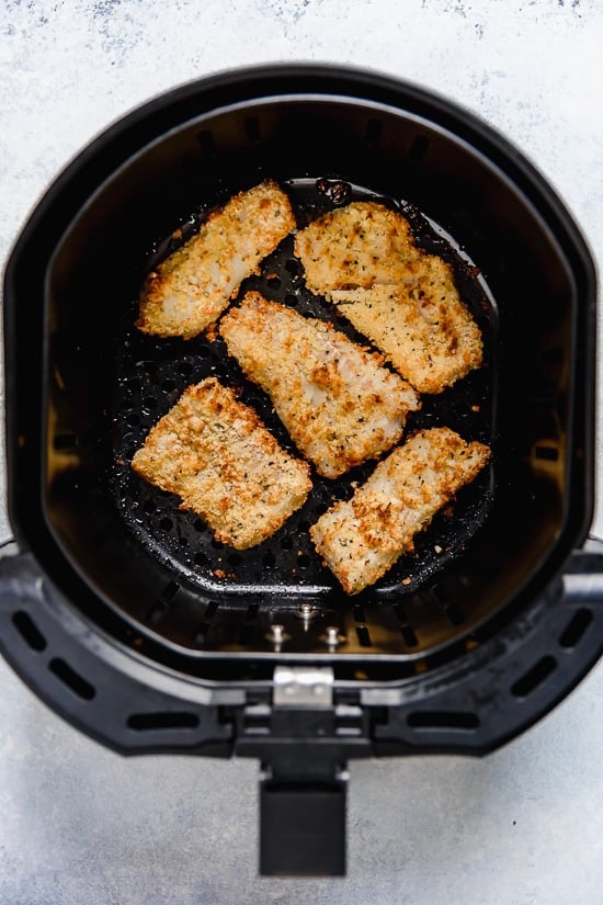 Tzatziki Fish Tacos have a Greek twist! Made with breaded white fish filet topped with mint tzatziki sauce.