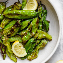 Air Fried Shishito Peppers come out charred and blistered with the air fryer, which uses much less oil! A squeeze of lemon over the top and they are delicious!