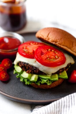Houston's copycat veggie burger on plate with cheese, tomato, avocado, and lettuce.