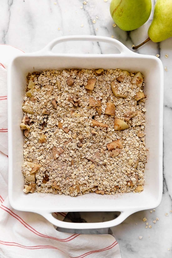 Baked oatmeal is like having dessert for breakfast! Made with healthy ingredients—bananas, pears, oats, nuts and maple syrup, it will leave you satisfied all morning.