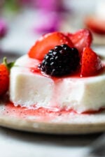 This simple Yogurt Panna Cotta is the perfect smooth, creamy dessert. The cool tang of yogurt pairs perfectly with fresh berries. To macerate the berries simple mix them with a little sugar and let them sit.