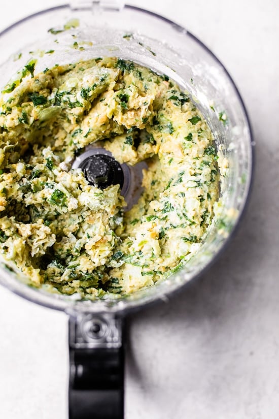 This easy air fryer falafel recipe is made quicker and lighter with canned chickpeas, and no deep frying! Perfect for serving with hummus. Blended chickpea falafel mixture in a food processor.