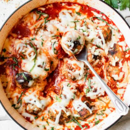 Cheesy Turkey Meatballs covered in sauce and cheese, made all in one skillet, serve this with a green salad and a little bread on the side for dipping!