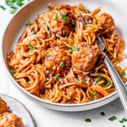 Bowl of Instant Pot spaghetti and turkey meatballs with fork.