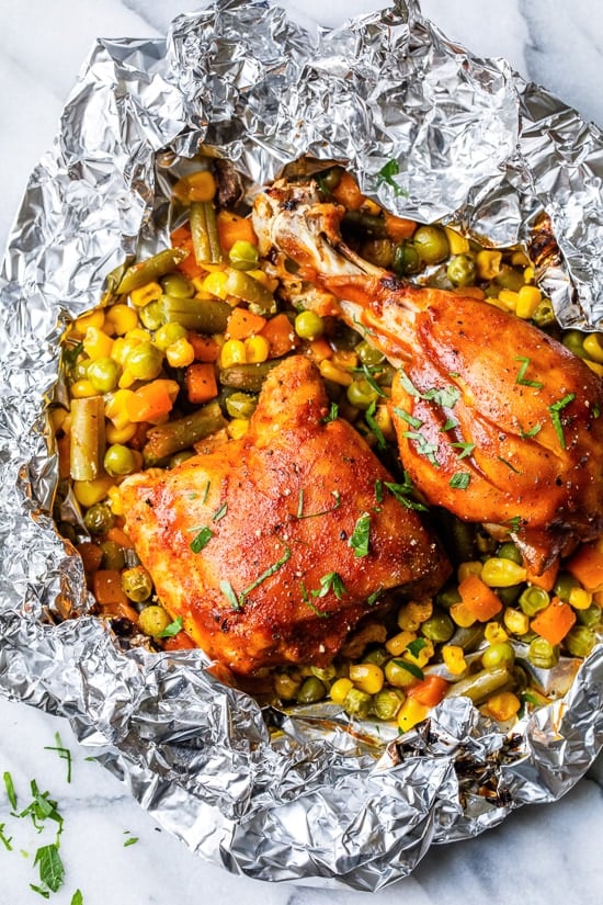 These easy 5-ingredient BBQ Chicken Foil Packets can be baked in the oven or made on the grill! An easy meal-in-one and the best part, easy cleanup!