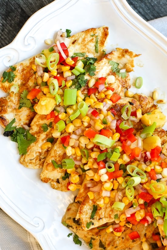 Zesty Lime Grilled Chicken with Pineapple Salsa on a platter.