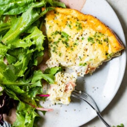 Crustless Quiche Lorraine on a plate with a fork.
