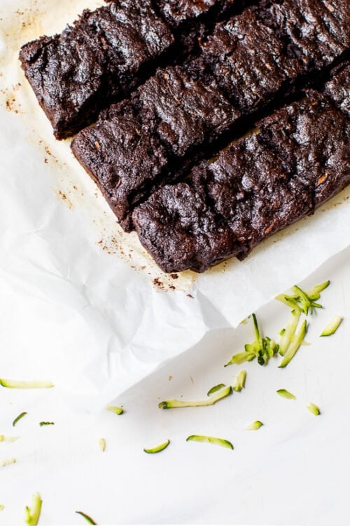 Sliced zucchini brownies on parchment paper