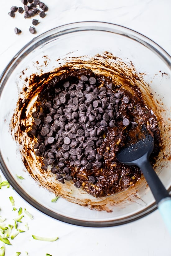 These easy Flourless Zucchini Brownies are made with almond meal, so they're naturally gluten-free. They're moist, fudgy, and so decadent! Flourless Zucchini Brownie batter in a bowl