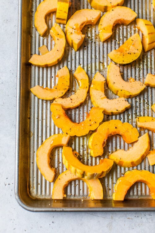 delicata squash on a sheet pan