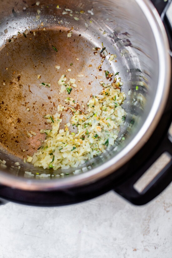 This Instant Pot Risotto recipe is the quickest, easiest way to make risotto. Perfectly creamy every time and it's ready in just 20 minutes. Aromatics sauteed in the Instant Pot