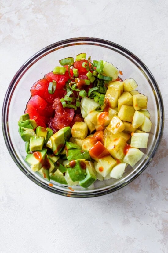 tuna, scallions, cucumber, avocado in a bowl