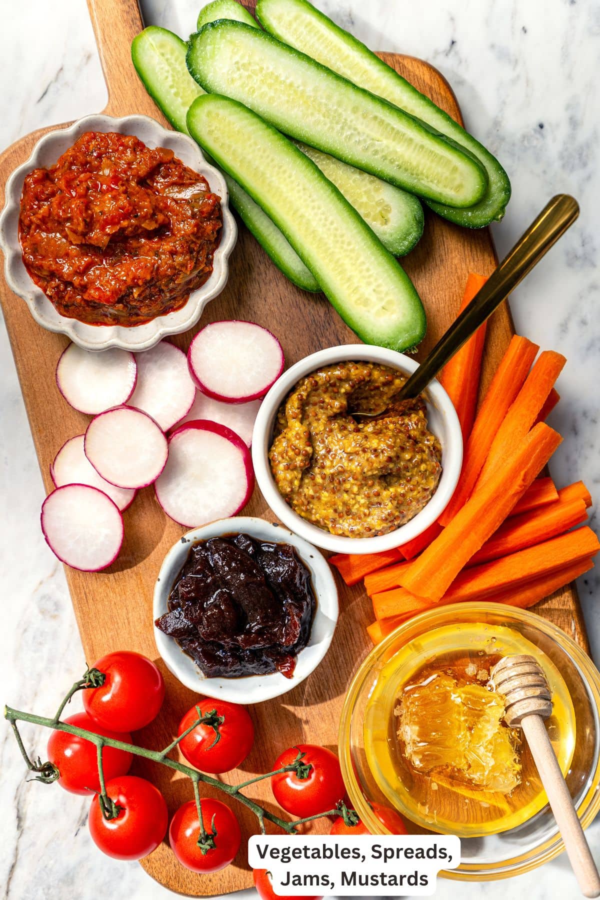 Your ultimate guide to creating a charcuterie and cheese board! I'll show you how to choose and arrange everything for a beautiful spread. Vegetables, spreads, jams, and mustard for charcuterie board.