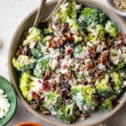 Broccoli Salad in a bowl with 2 spoons