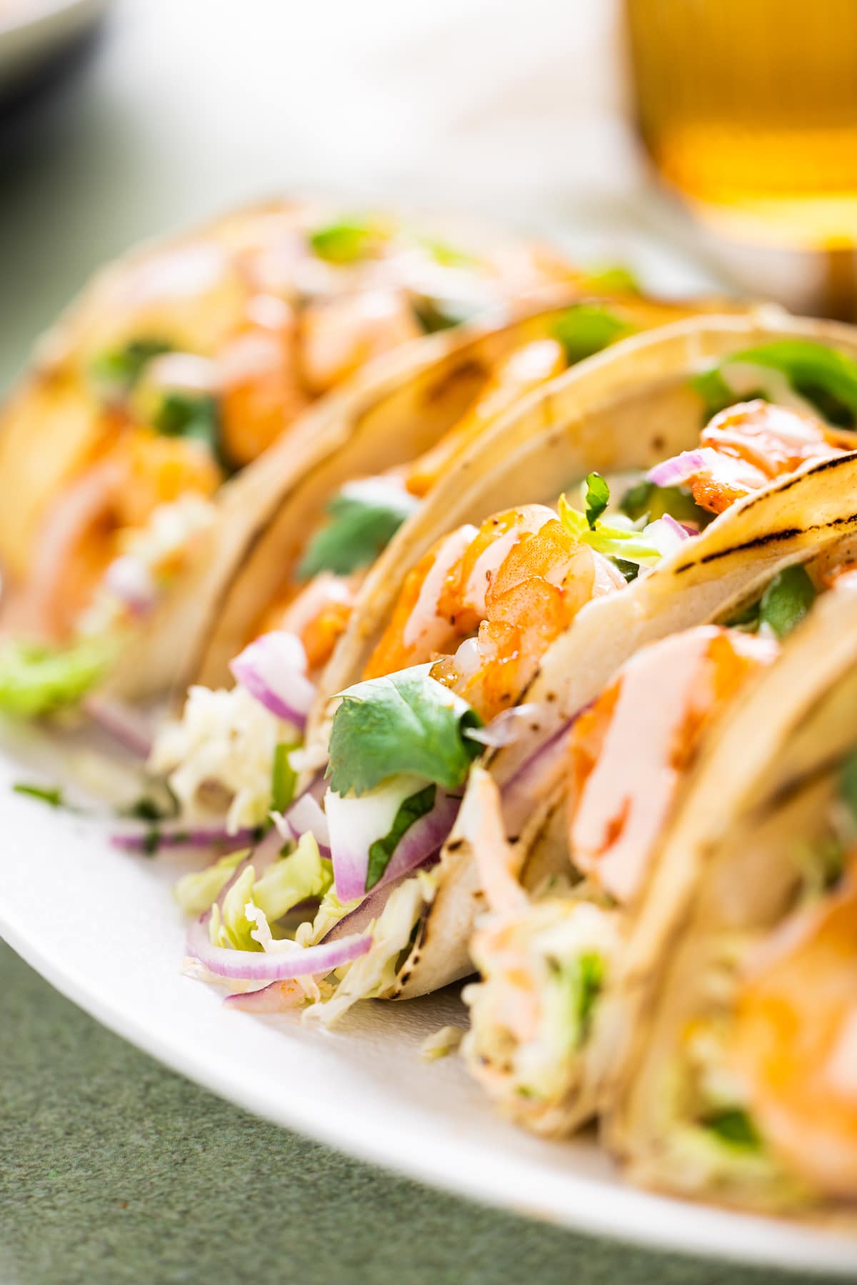 Shrimp tacos with cilantro lime slaw served on corn tortillas