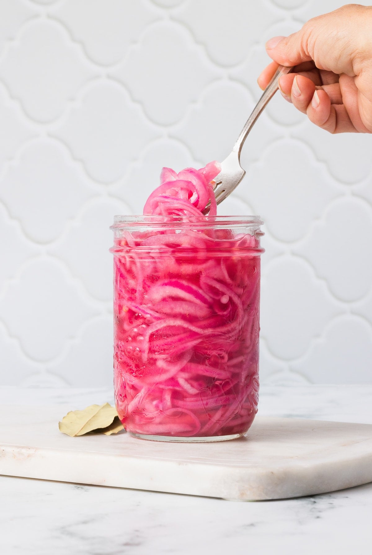 These easy pickled red onions are add a tangy, slightly sweet, and crunchy element to steaks, sandwiches, tacos, burrito bowls and more! Pickled Red Onions