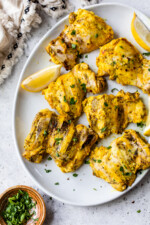 platter of grilled chicken thighs
