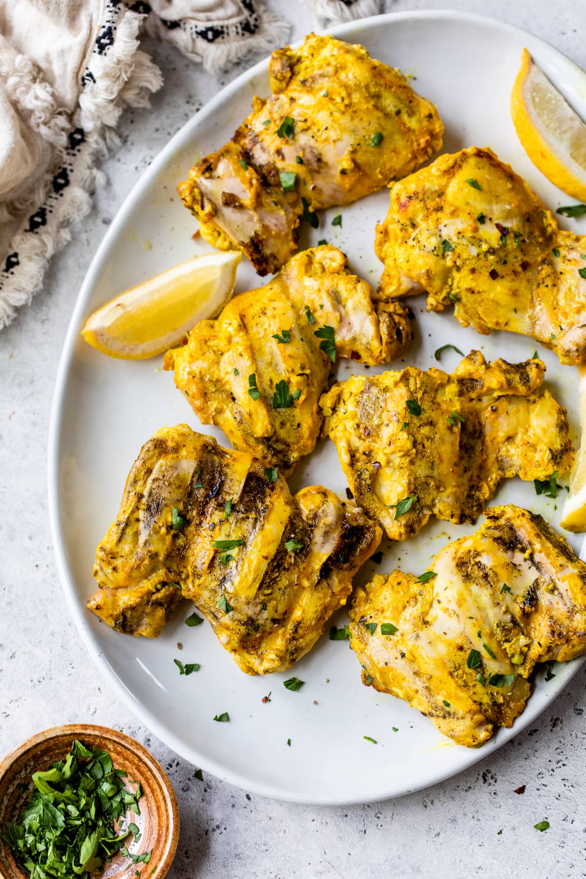 platter of grilled chicken thighs