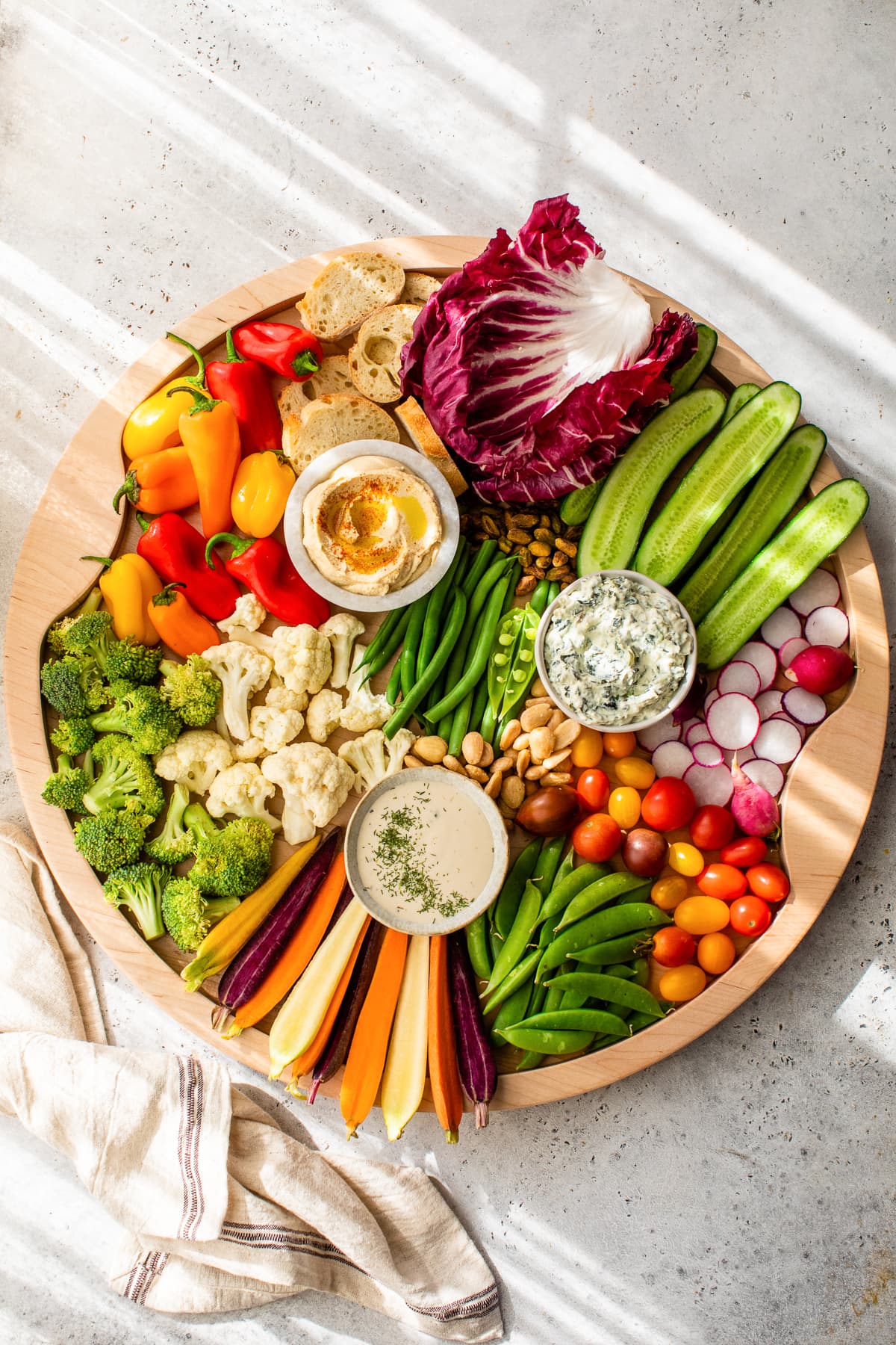 Overhead view of veggie tray with dips
