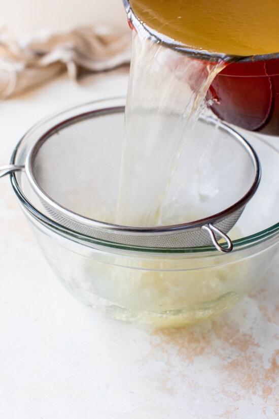Made with just a handful of ingredients, this rich and flavorful Turkey Stock recipe is the secret to creating a memorable turkey gravy. Draining Turkey Stock through a mesh sieve
