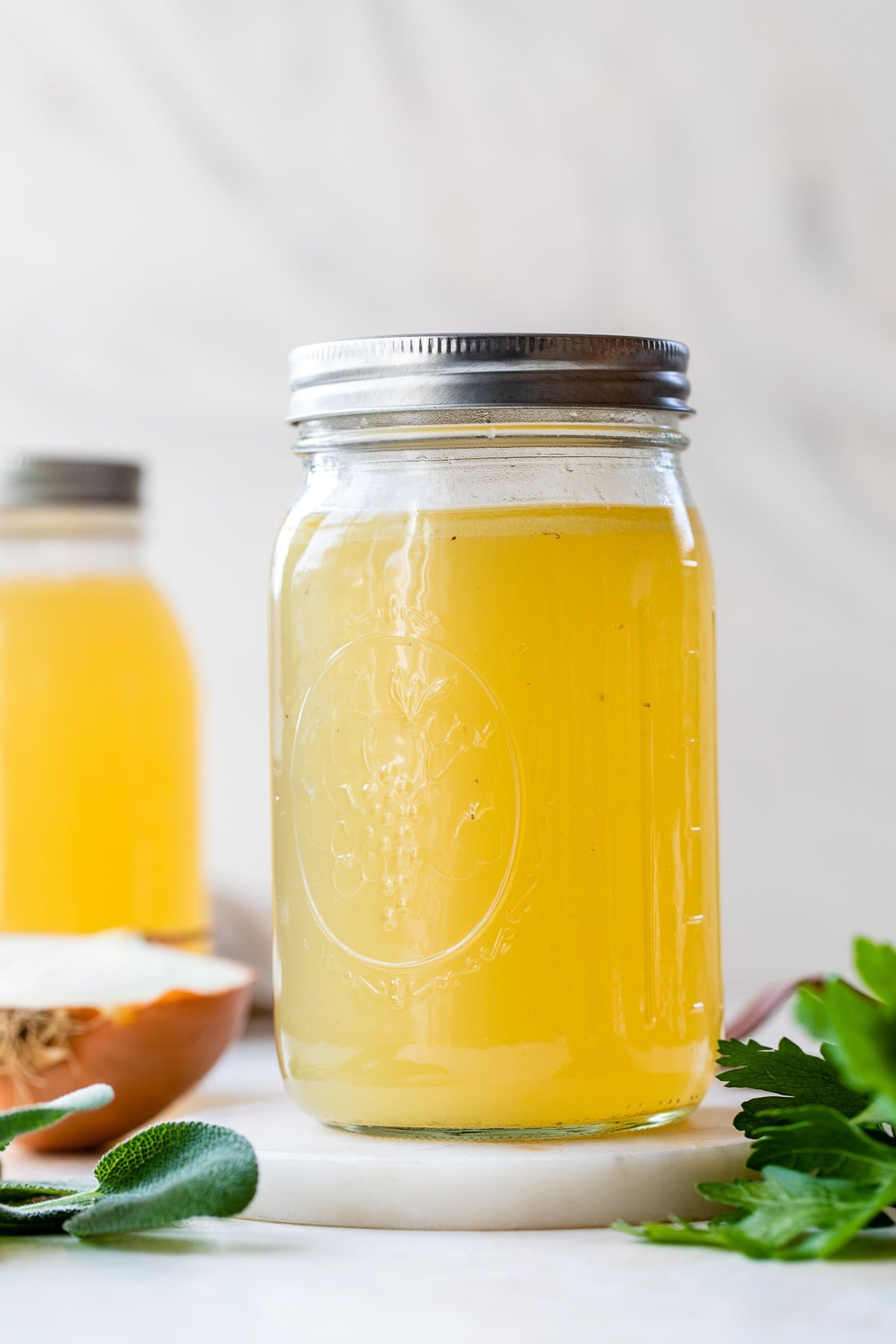 Made with just a handful of ingredients, this rich and flavorful Turkey Stock recipe is the secret to creating a memorable turkey gravy. Turkey Stock in a mason jar