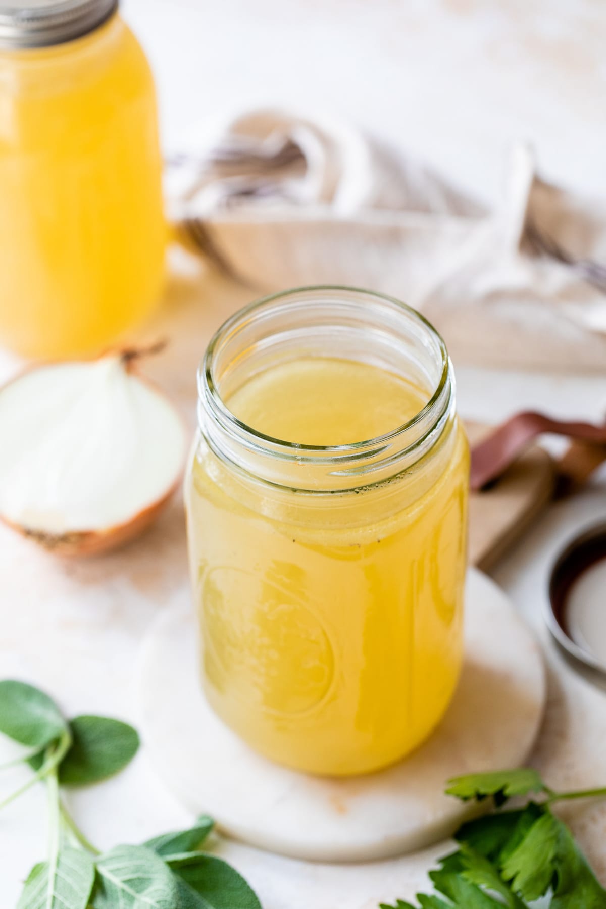 Made with just a handful of ingredients, this rich and flavorful Turkey Stock recipe is the secret to creating a memorable turkey gravy. Turkey Stock in a mason jar