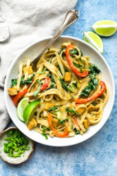 Green Curry Noodles in a bowl with limes.