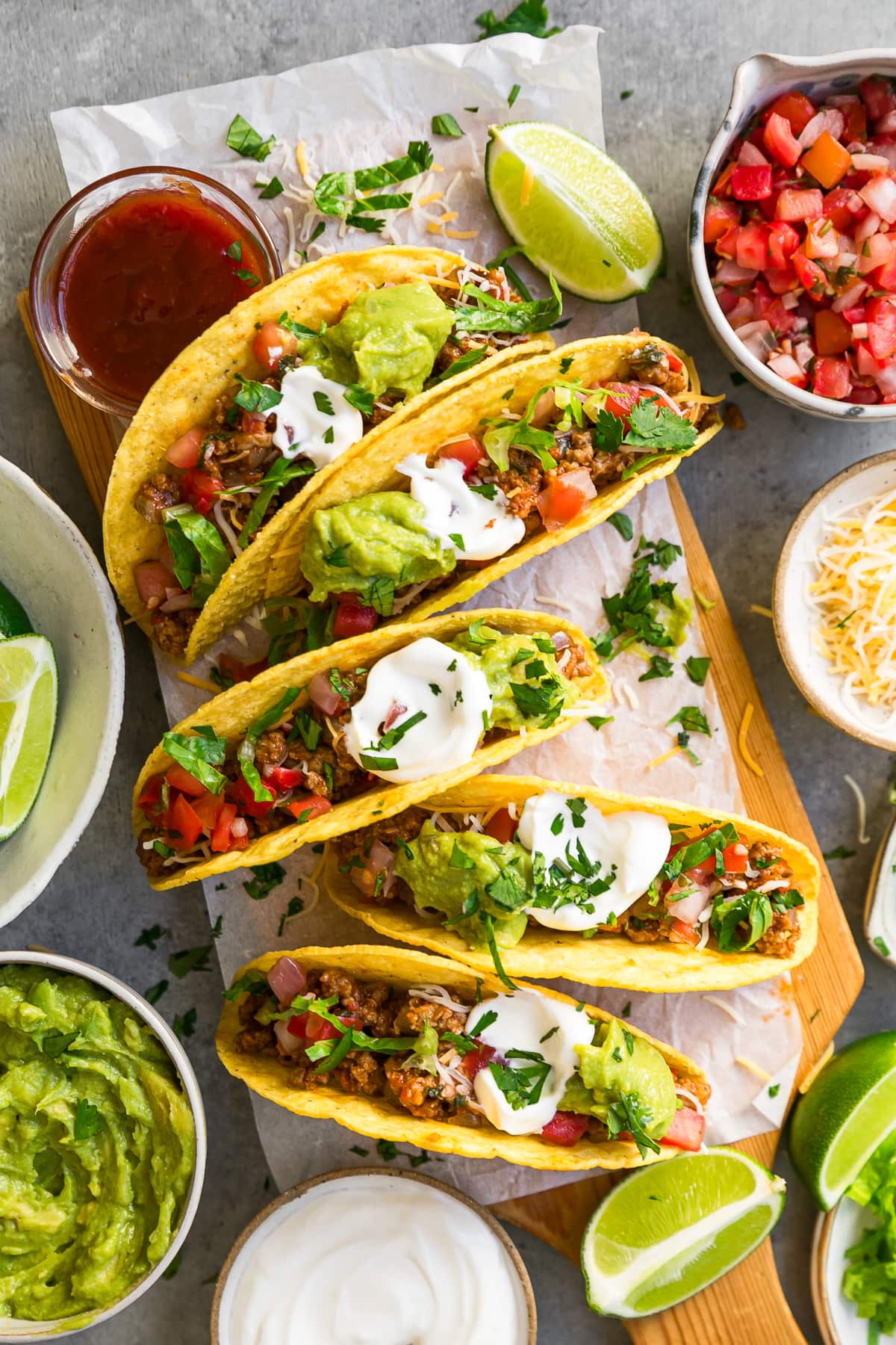 tacos and all the fixins on a board