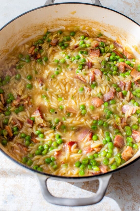 Add orzo and broth.