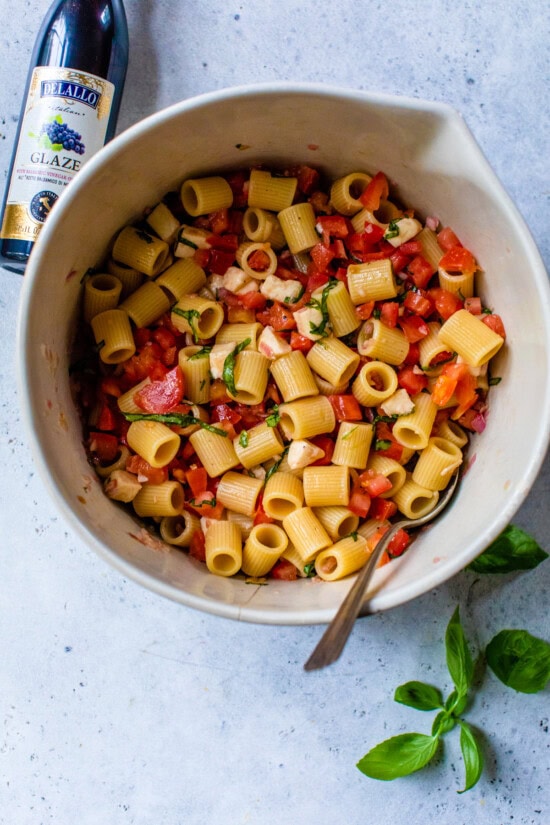 Mix pasta together in a bowl.