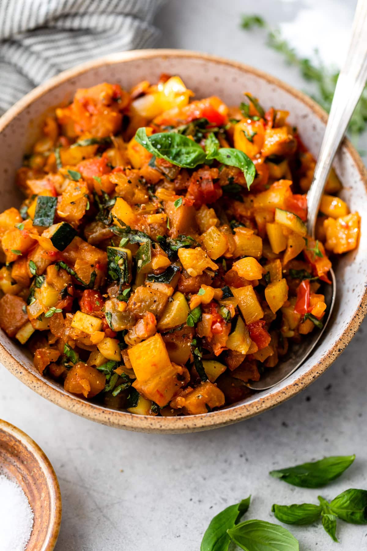 This easy ratatouille recipe is the perfect summer side dish for your favorite roasted chicken, grilled meats, or fish! A bowl filled with homemade ratatouille.