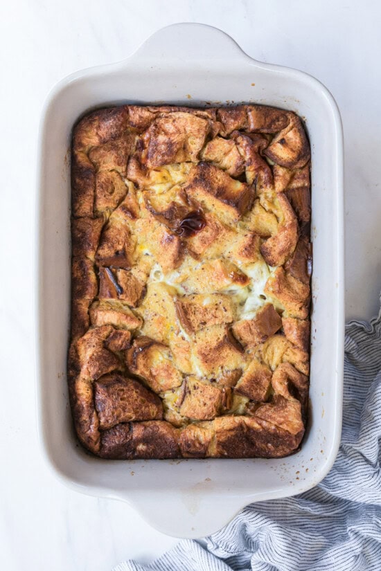 This overnight crème brûlée French toast bake is an easy make-ahead breakfast with fluffy challah, eggy custard, and only 15 minutes of prep! Overhead view of a baked creme brulee French toast casserole.