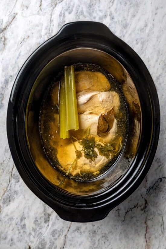This slow cooker shredded chicken recipe is juicy, tender, and flavorful. It's a hands-off cooking method perfect for meal prep! Ingredients for slow cooker shredded chicken in crockpot