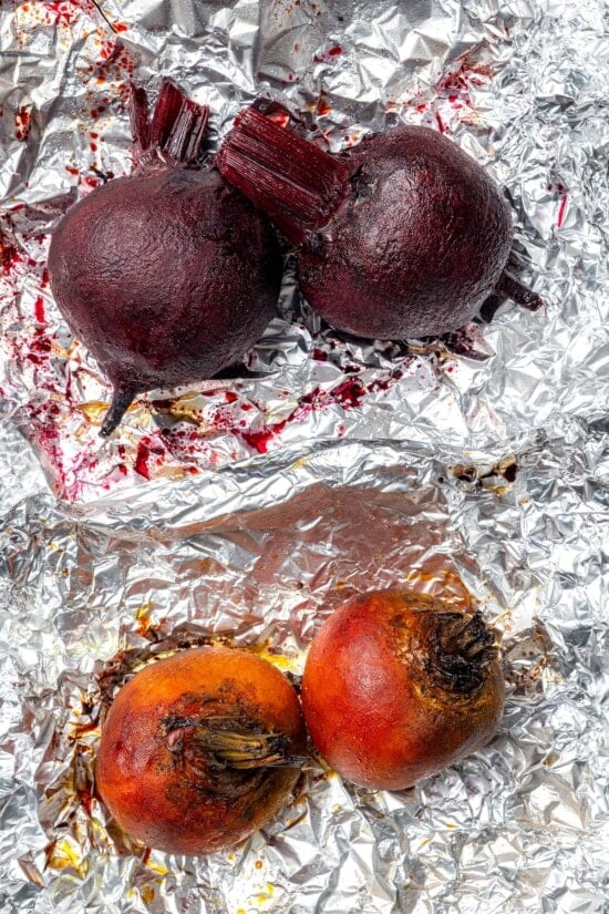 This Roasted Beet and Citrus Salad pairs tender beets with creamy goat cheese, citrus fruit and pistachios for a show-stopping holiday side! Roasted red and golden beets on foil.