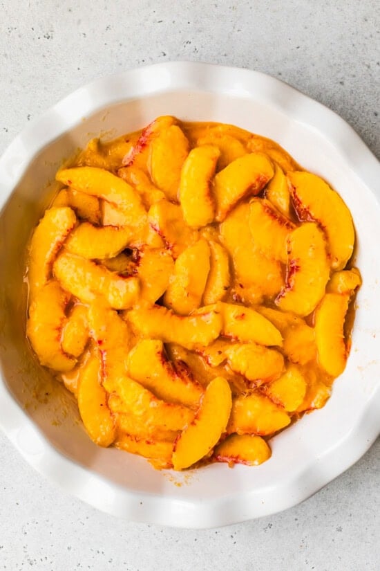 peaches in a pie dish